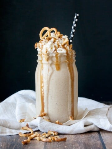 vegan protein salted carmel pretzel oatmeal cookie smoothie with a black background