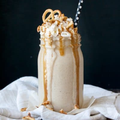 vegan protein salted carmel pretzel oatmeal cookie smoothie with a black background