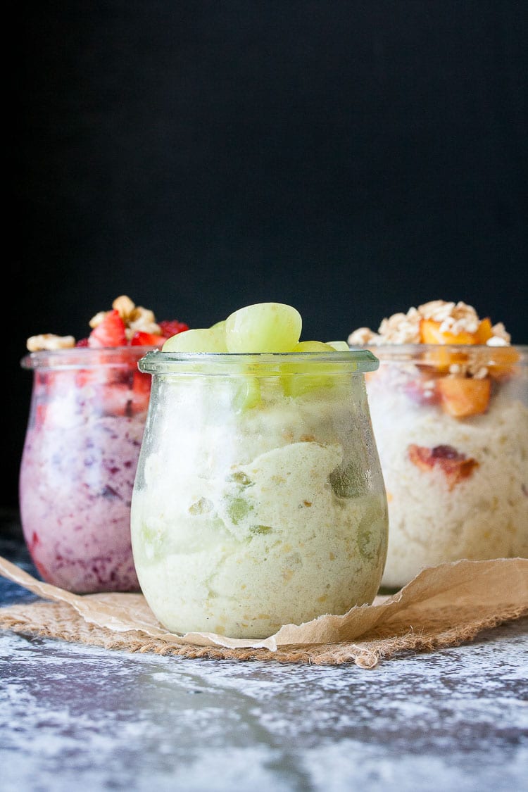 Three glass jars filled with instant frozen yogurt and toppings