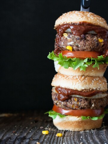 two vegan barbecue burgers stacked on top of each other