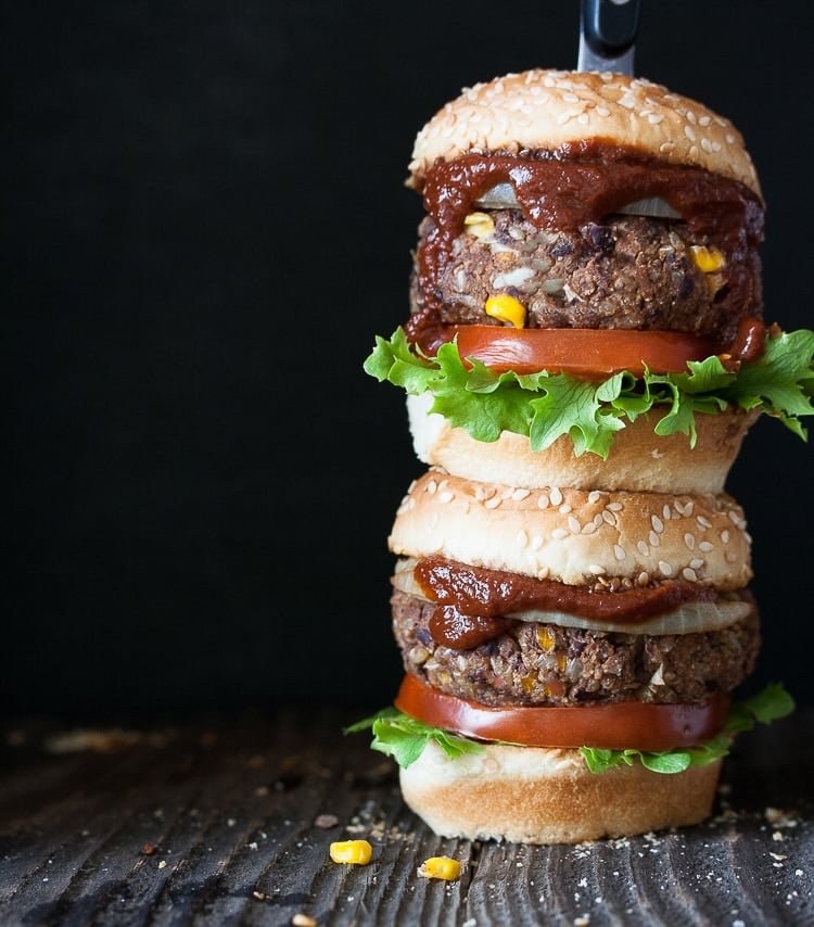 two vegan barbecue burgers stacked on top of each other