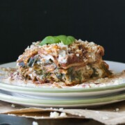 a photo of a vegan lasagna slice on a plate