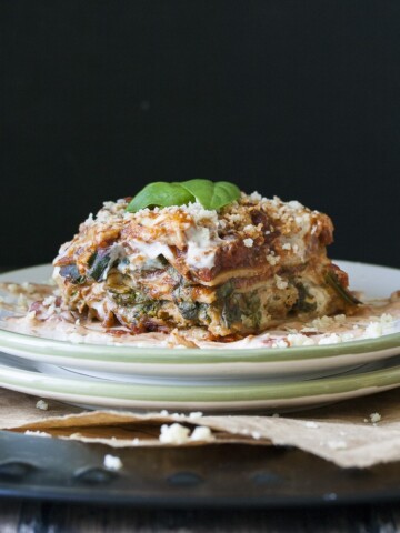 a photo of a vegan lasagna slice on a plate