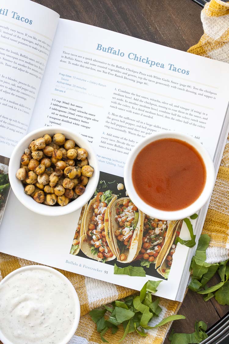 Top view of taco recipe from a cookbook next to recipe ingredients