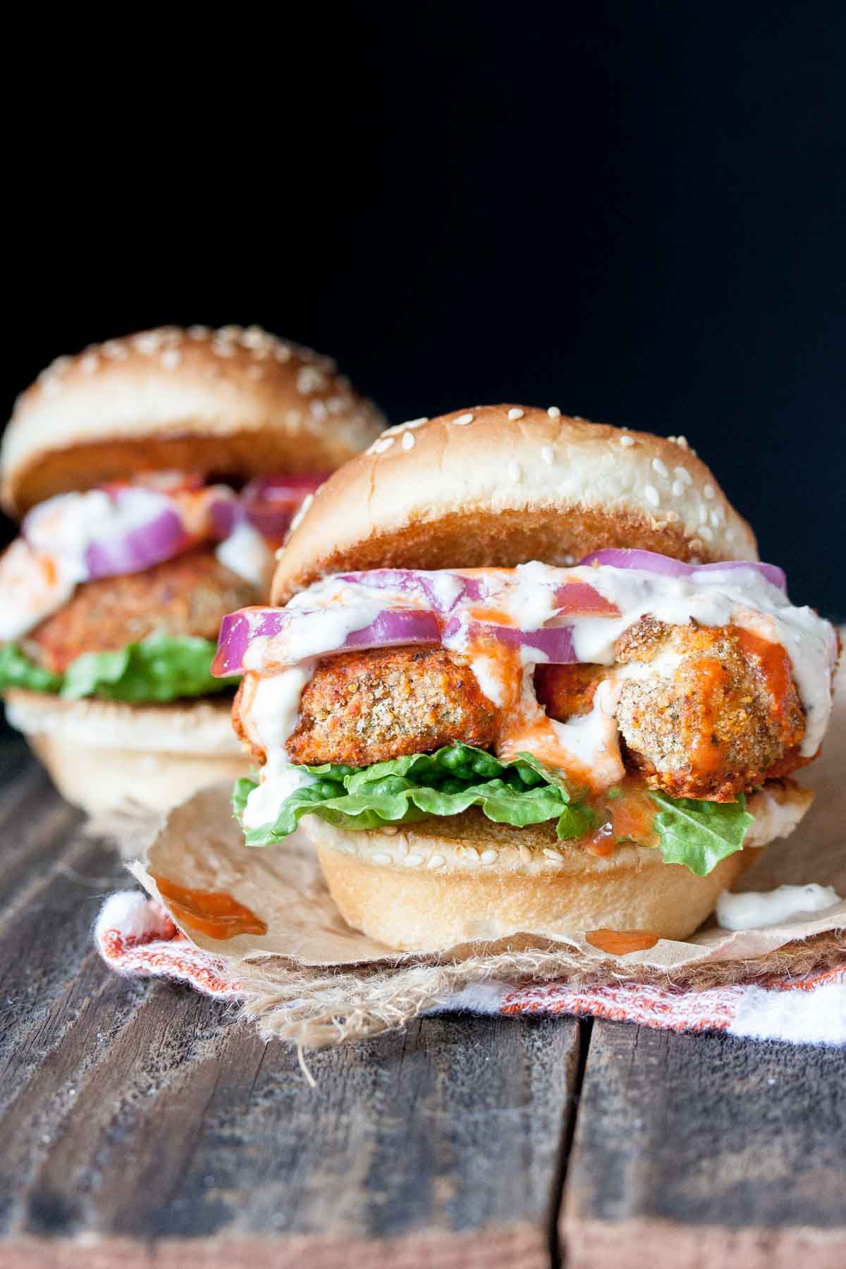 vegan buffalo wing slider with red onion, lettuce and ranch