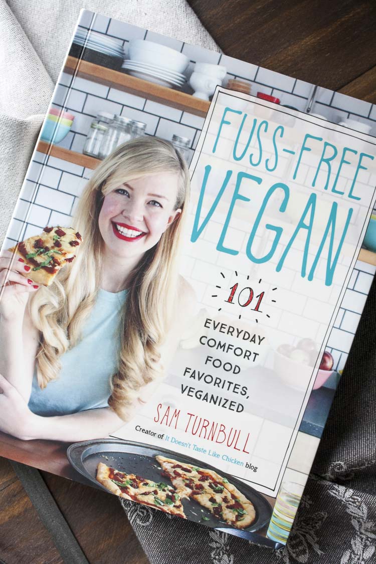 Cover of a vegan cookbook with a picture of the blond female author on it