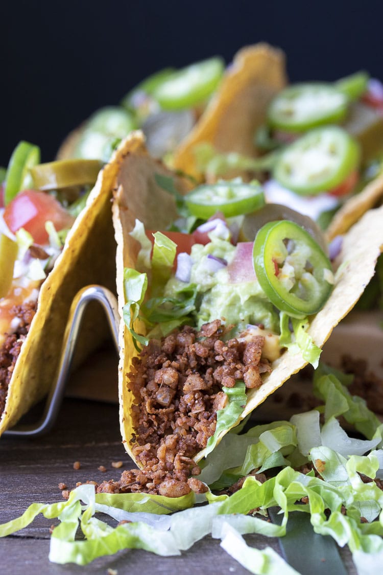 Close up of a fully loaded vegan crispy taco