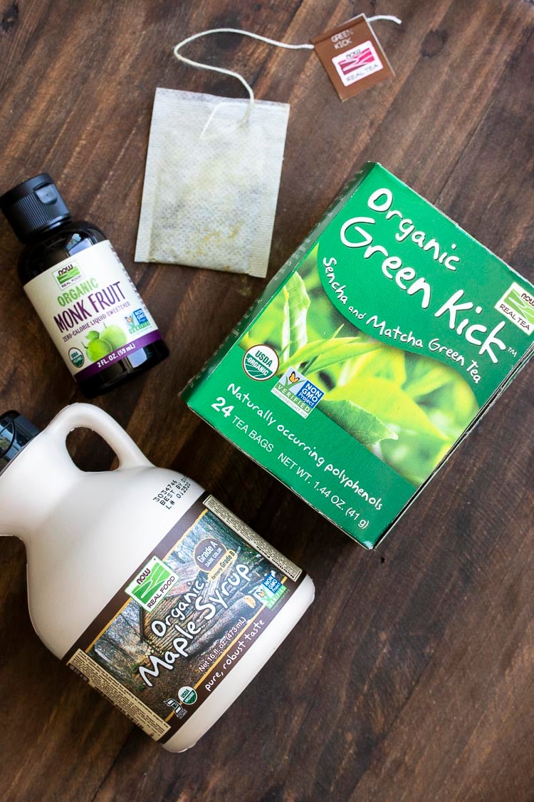 Box of green tea, bottle of maple syrup and bottle of liquid sweetener