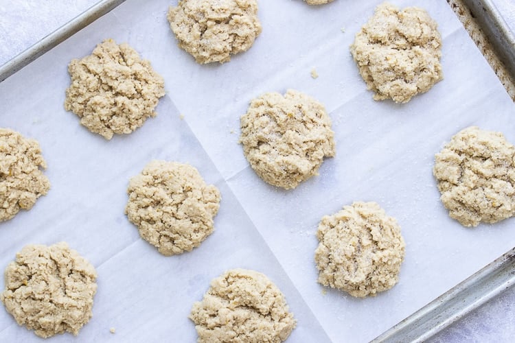 Top view of raw strawberry shortcake biscuits on parchment paper