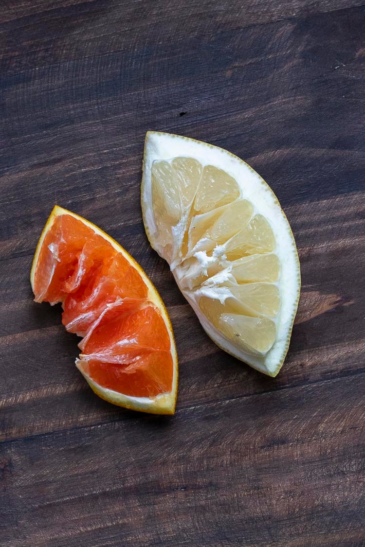 Slice of an orange and grapefruit inverted to show the pulp