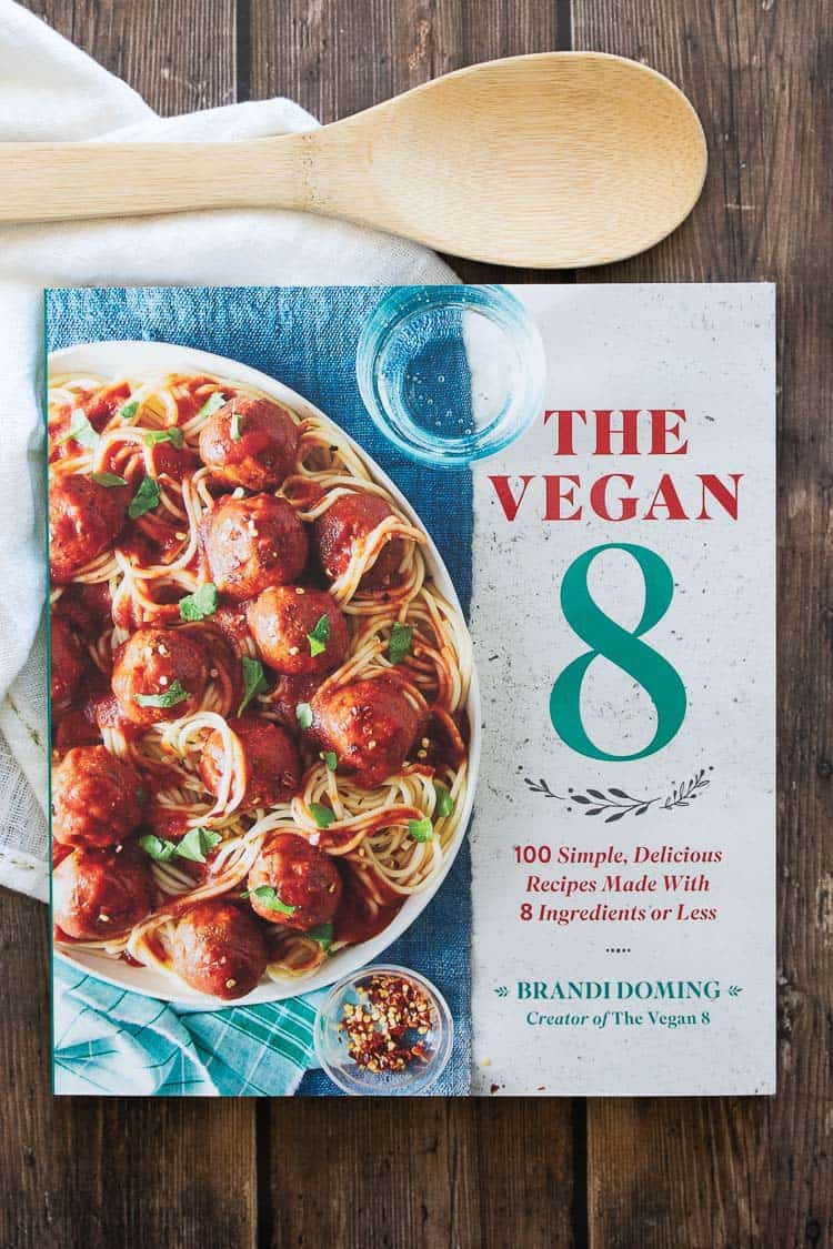 The Vegan 8 cookbook cover with spaghetti and vegan meatballs on the front