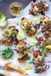 Top view of baked sweet potato skins fully loaded with toppings