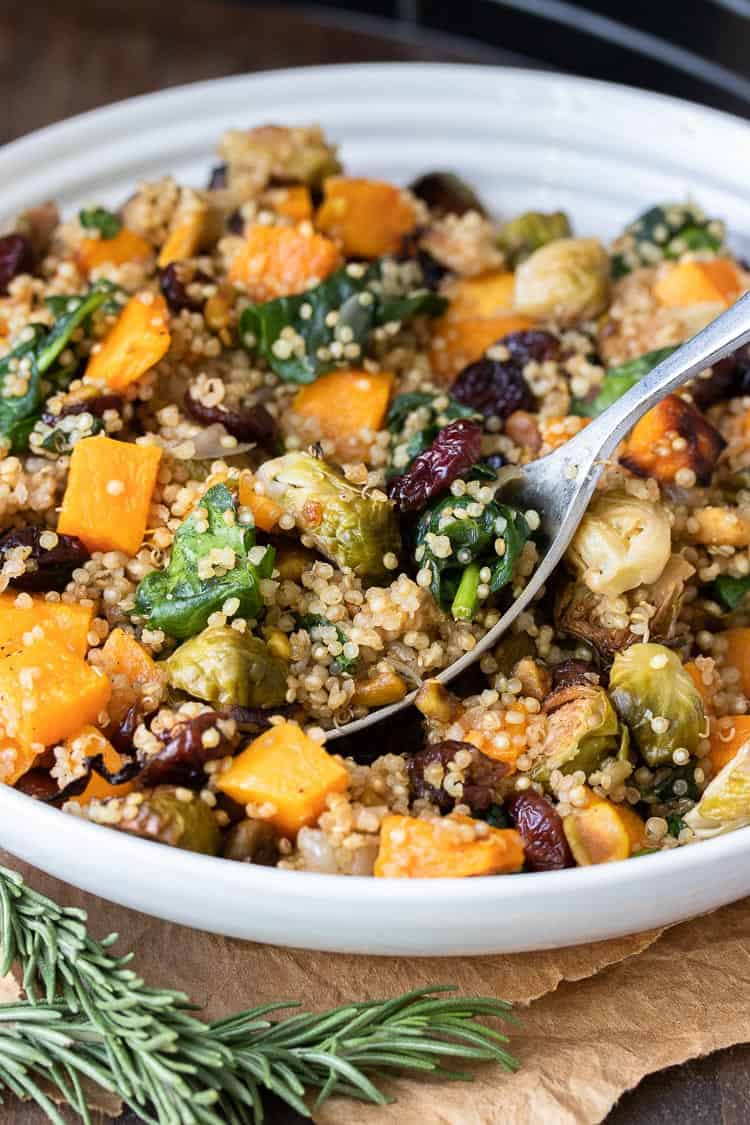 Spoon scooping out a bite of veggie and quinoa stuffing.