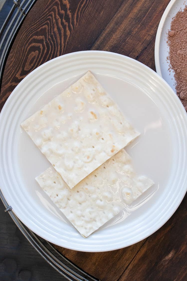 White bowl with milk and flatbread pieces inside