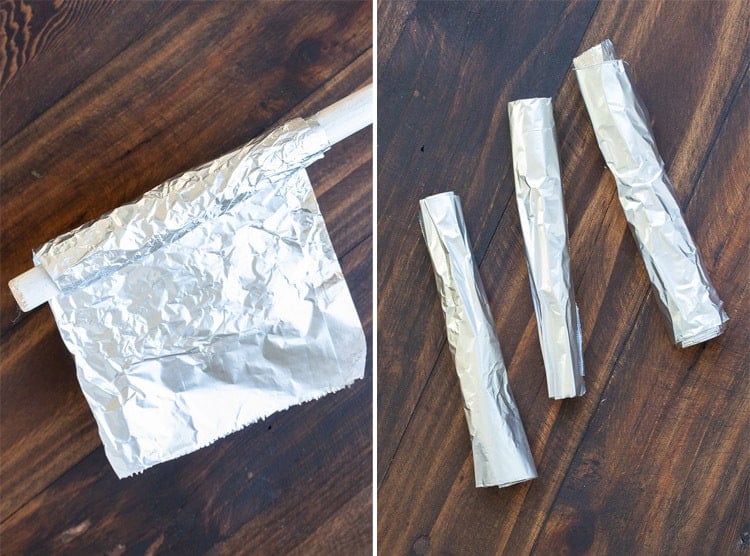 Collage of tin foil wrapped around a dowel and tubes of tin foil