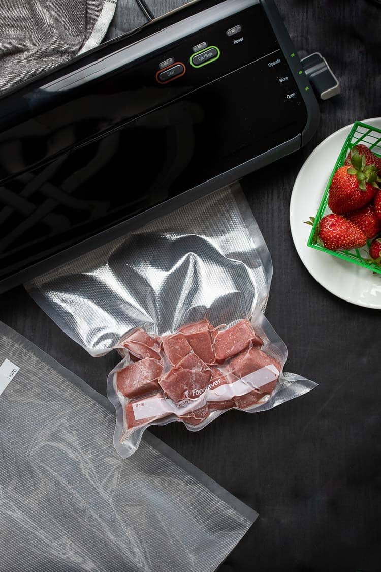 Strawberry syrup ice cubes in a vacuum seal bag