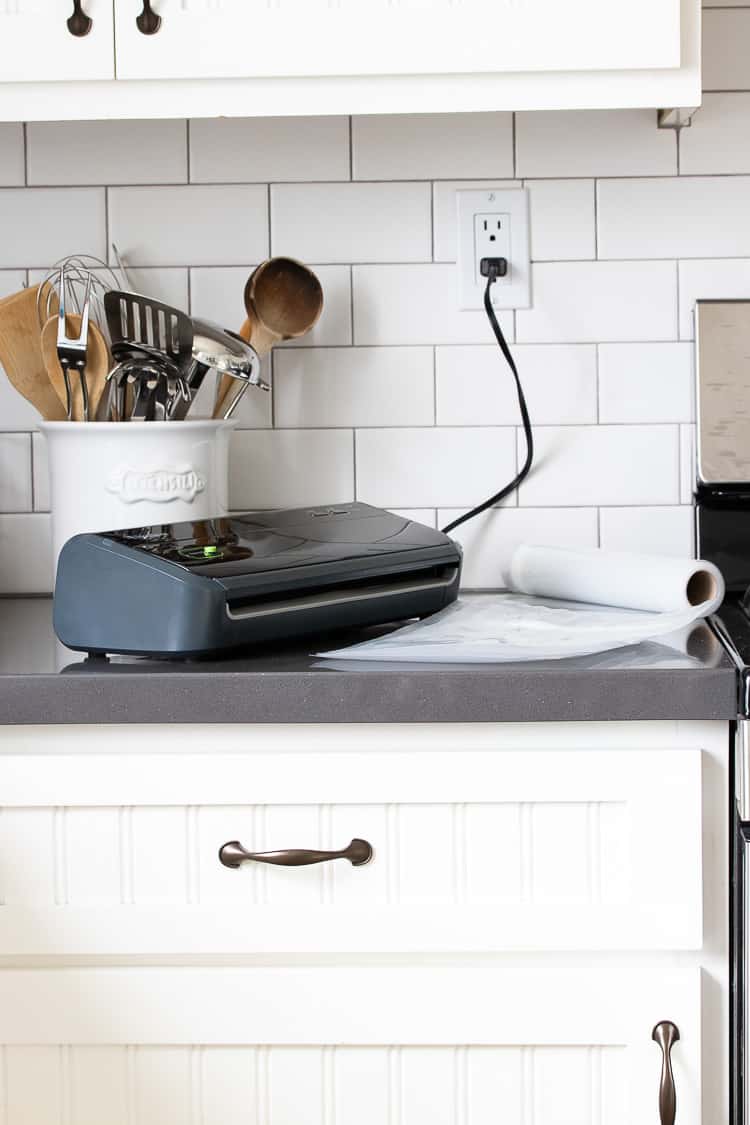 Foodsaver machine on a grey kitchen countertop