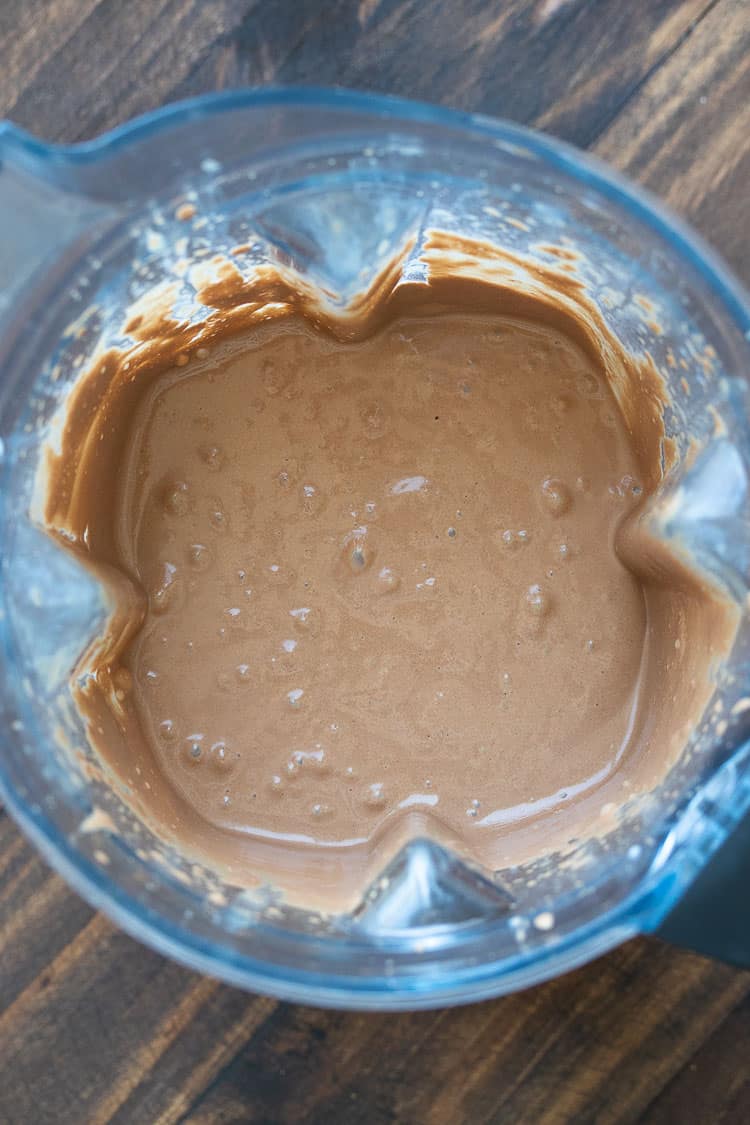 Top view of a blender filled with a chocolate smoothie