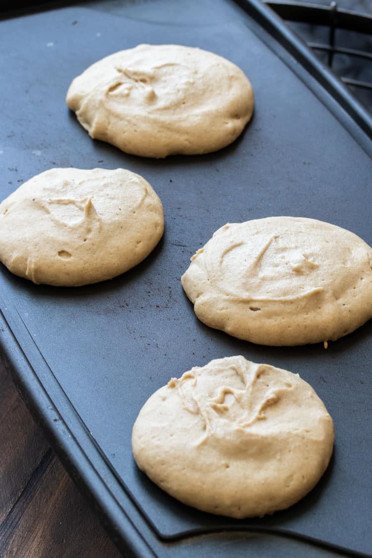 Pancakes cooking on a griddle