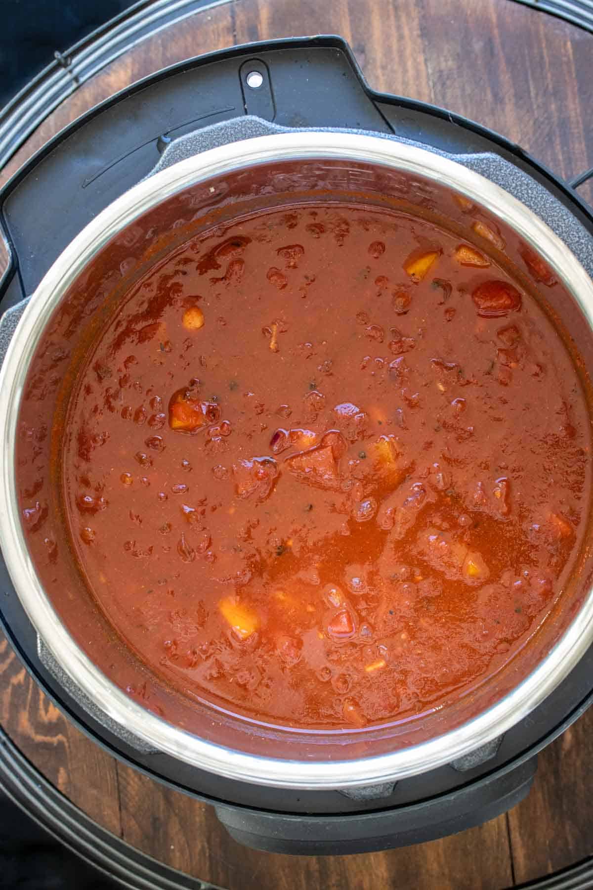 Slow cooker with bean chili ingredients inside