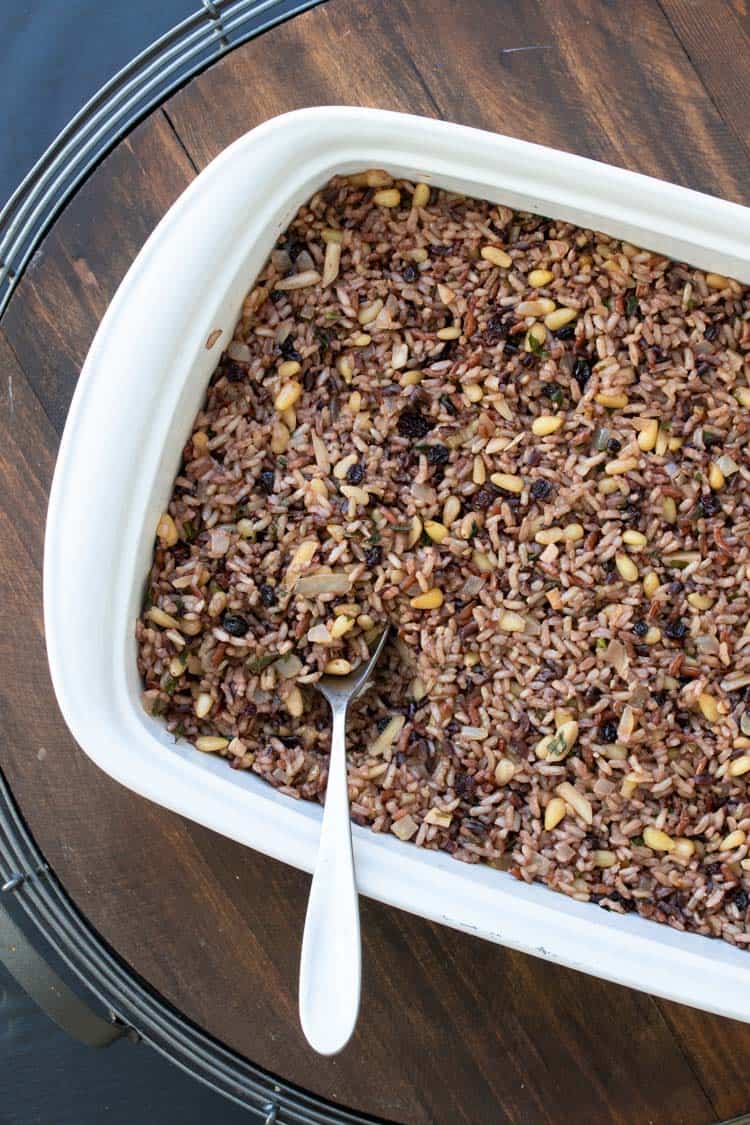 Rice stuffing in a white baking dish.