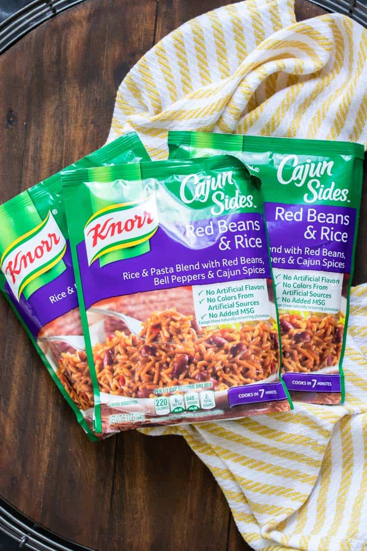 3 packs of Knorr Cajun red beans and rice on a wooden table