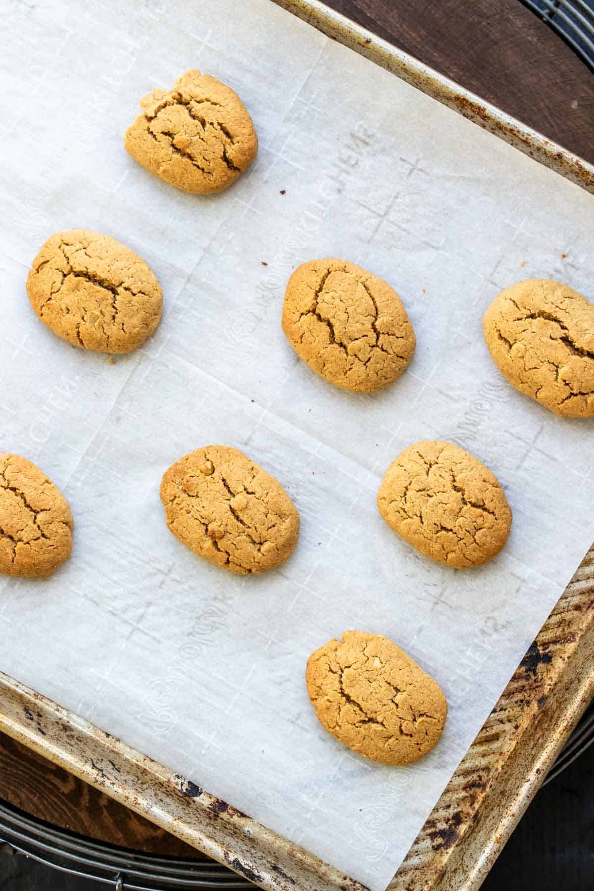 Baked melomakarona cookies on a cookie sheet