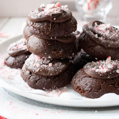 Pile of peppermint brownies on a white plate