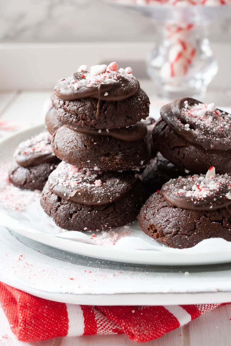 Pile of peppermint brownies on a white plate