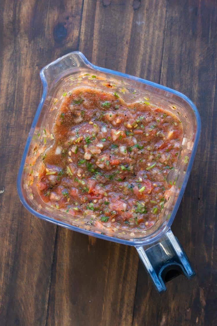 Top view of blender with fresh salsa inside