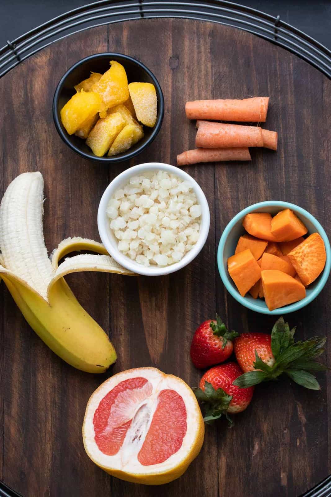 Fruit and vegetables good for the immune system on a round wooden tray