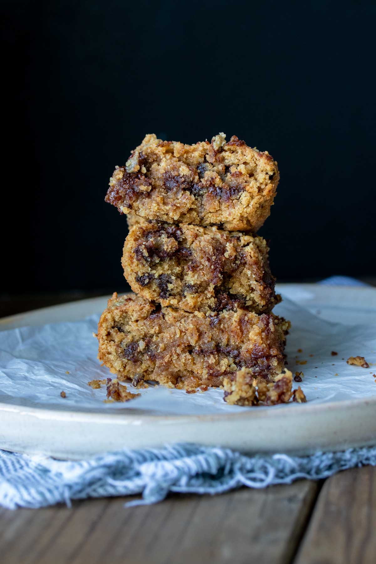 Stack of three pieces of blondies on a white plate