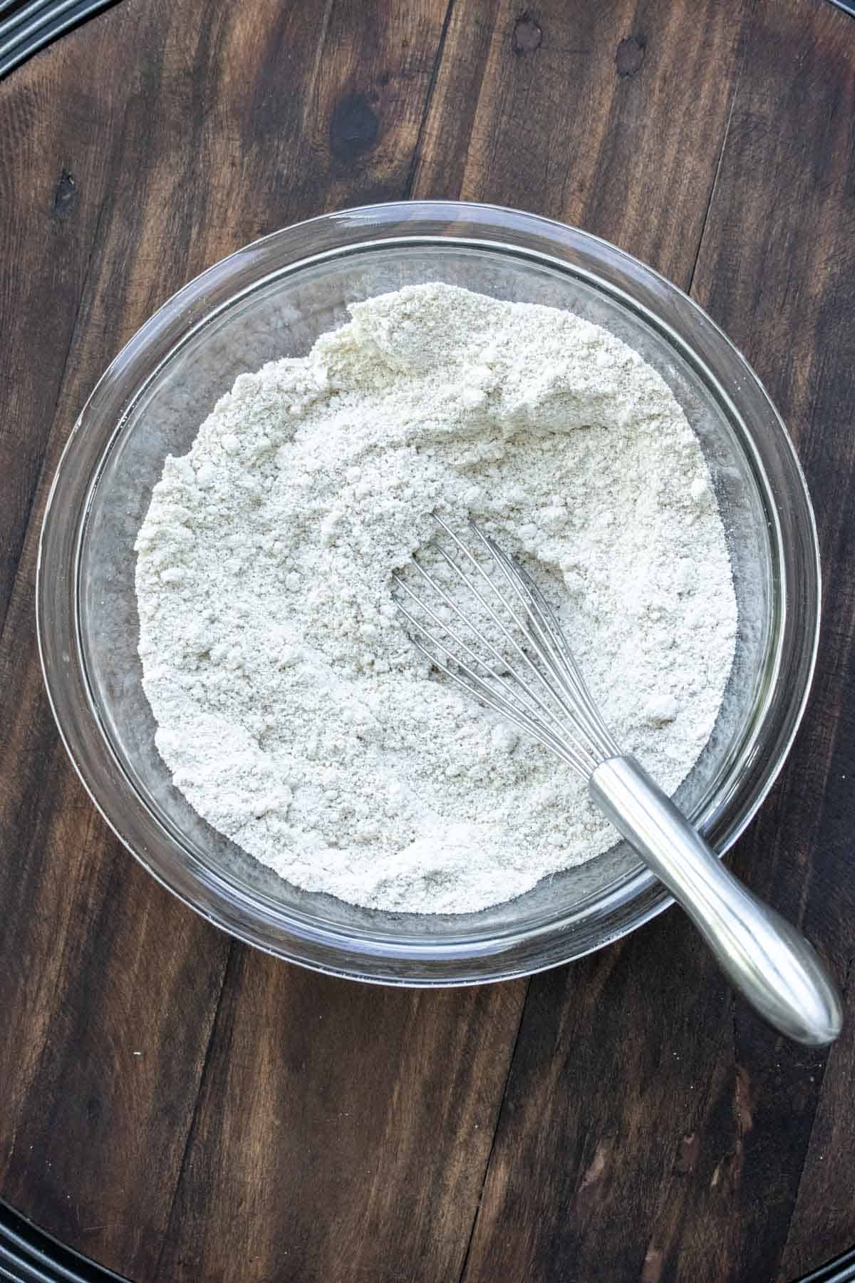 Whisk mixing flour in a glass bowl