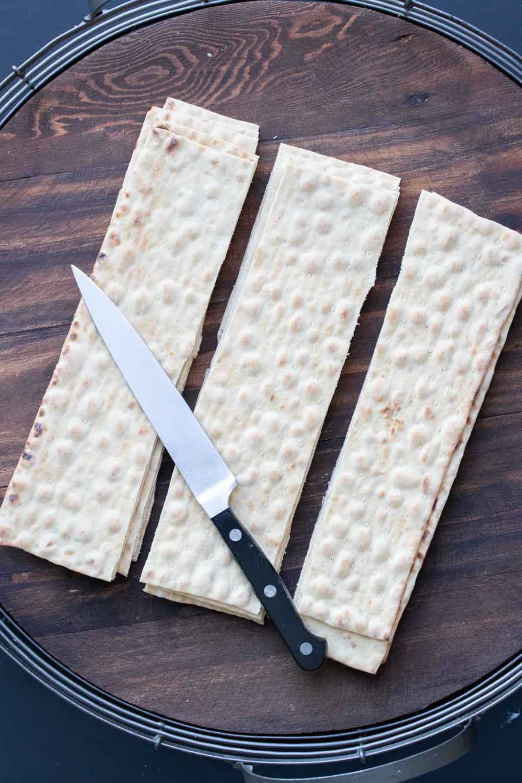 Knife on top of sliced pieces of lavash bread