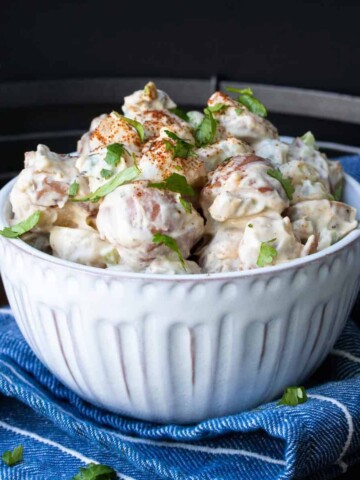 This vegan potato salad is one of my husband's favorite recipes! It is made with all whole foods, no mayo, and pairs perfectly with just about anything. #veganrecipes #picnicfoodideas