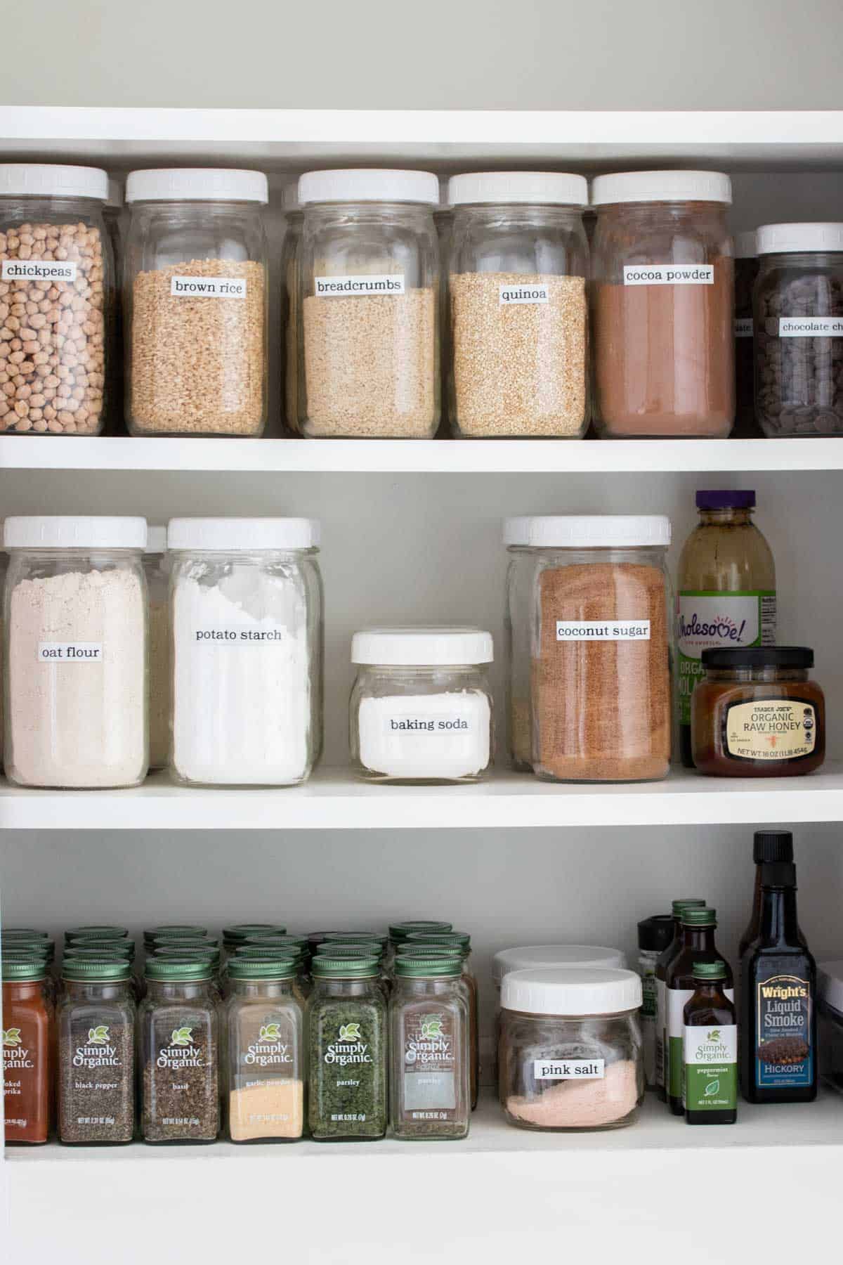Inside of a pantry with items in glass jars.