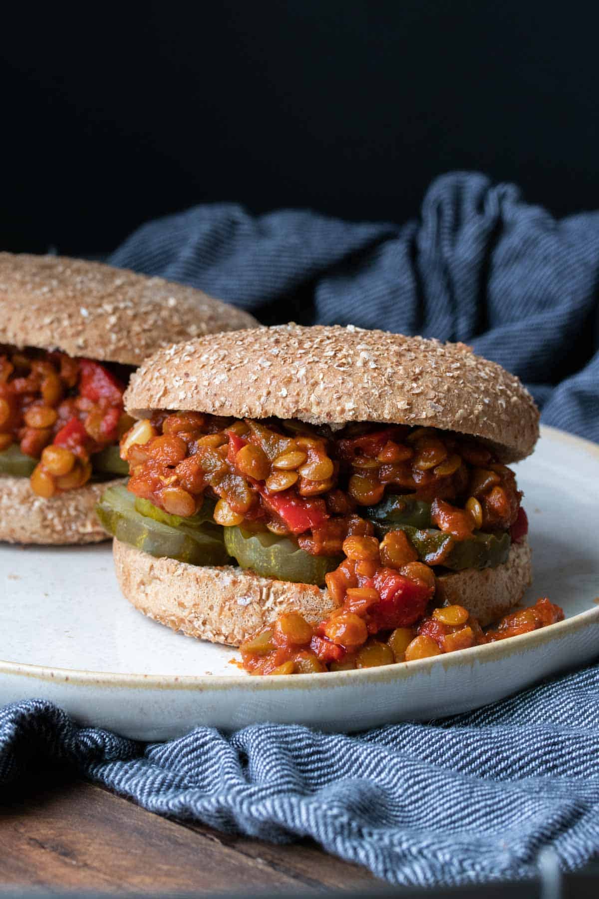 Lentil sloppy joes on a wheat bun with pickles.