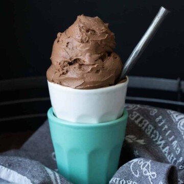 Two stacked cups with chocolate ice cream in the top one