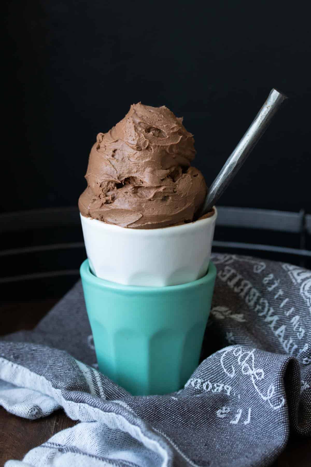 Two stacked cups with chocolate ice cream in the top one