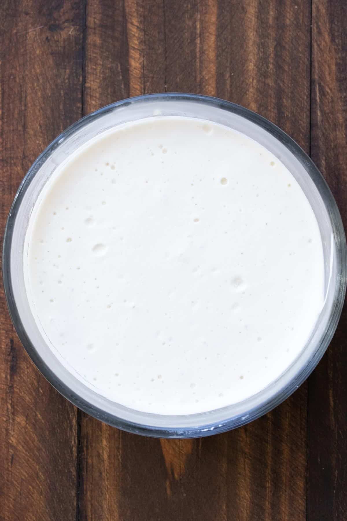 Thickened homemade yogurt in a glass bowl