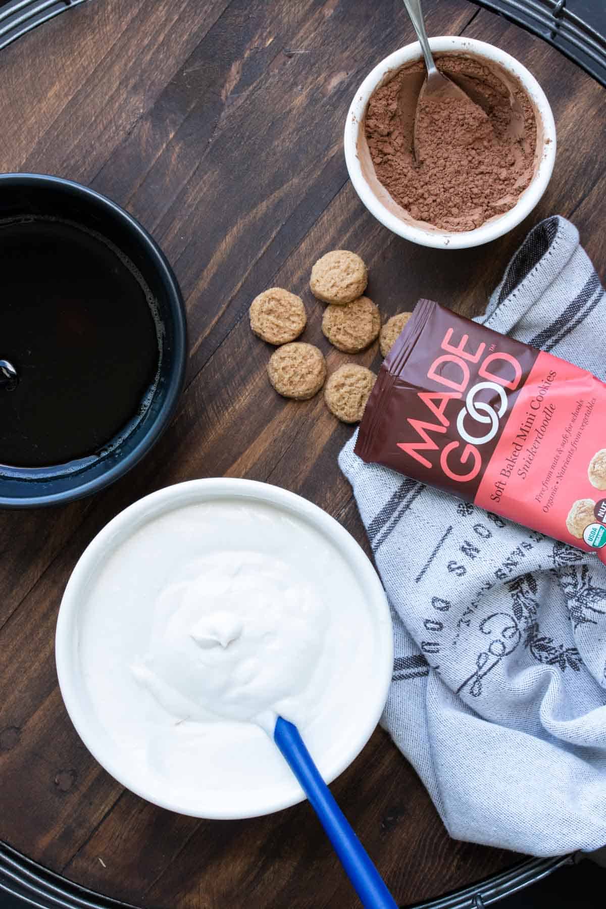 Top view of tiramisu ingredients sitting on a wooden table