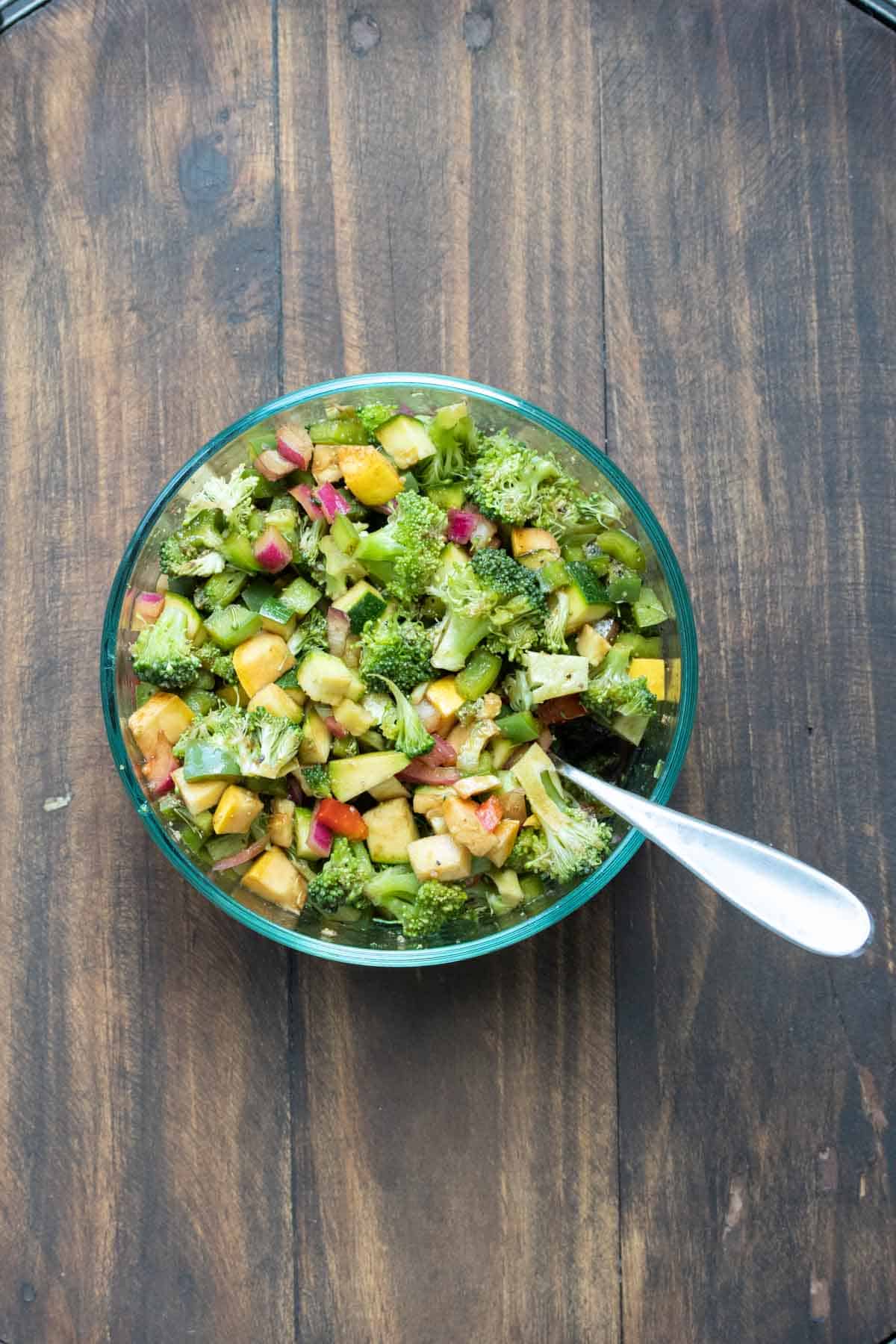 Glass bowl with chopped vegetables marinating in vinegar