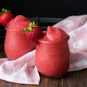 Blended frozen strawberries and rose wine in two glasses.