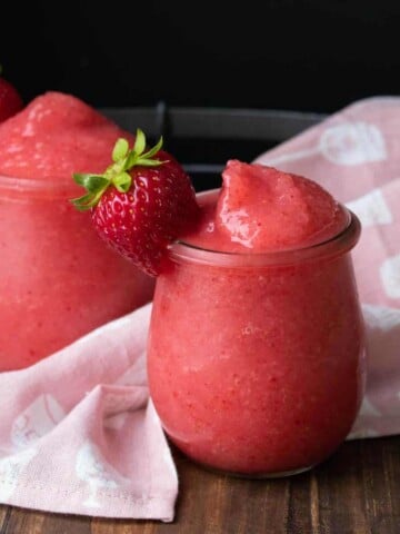 Blended frozen strawberries and rose wine in two glasses.