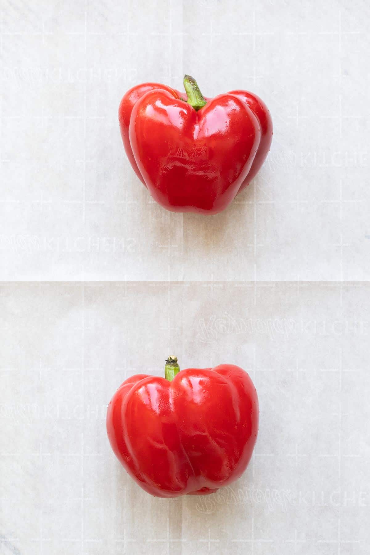 Two red peppers on a sheet of parhcment