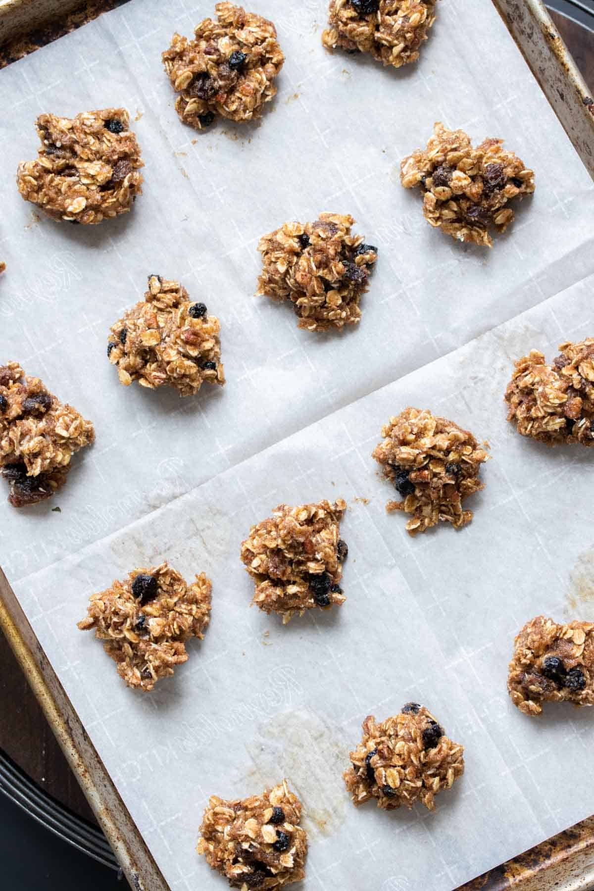 Top view of spoonfuls of cookie dough on a baking sheet