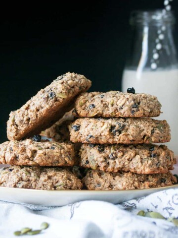 Stack of oat breakfast cookies on a pink plate