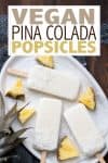 Text overlay on top of a photo of pina colada popsicles on a white plate