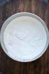 Top view of coconut whipped cream in a silver bowl