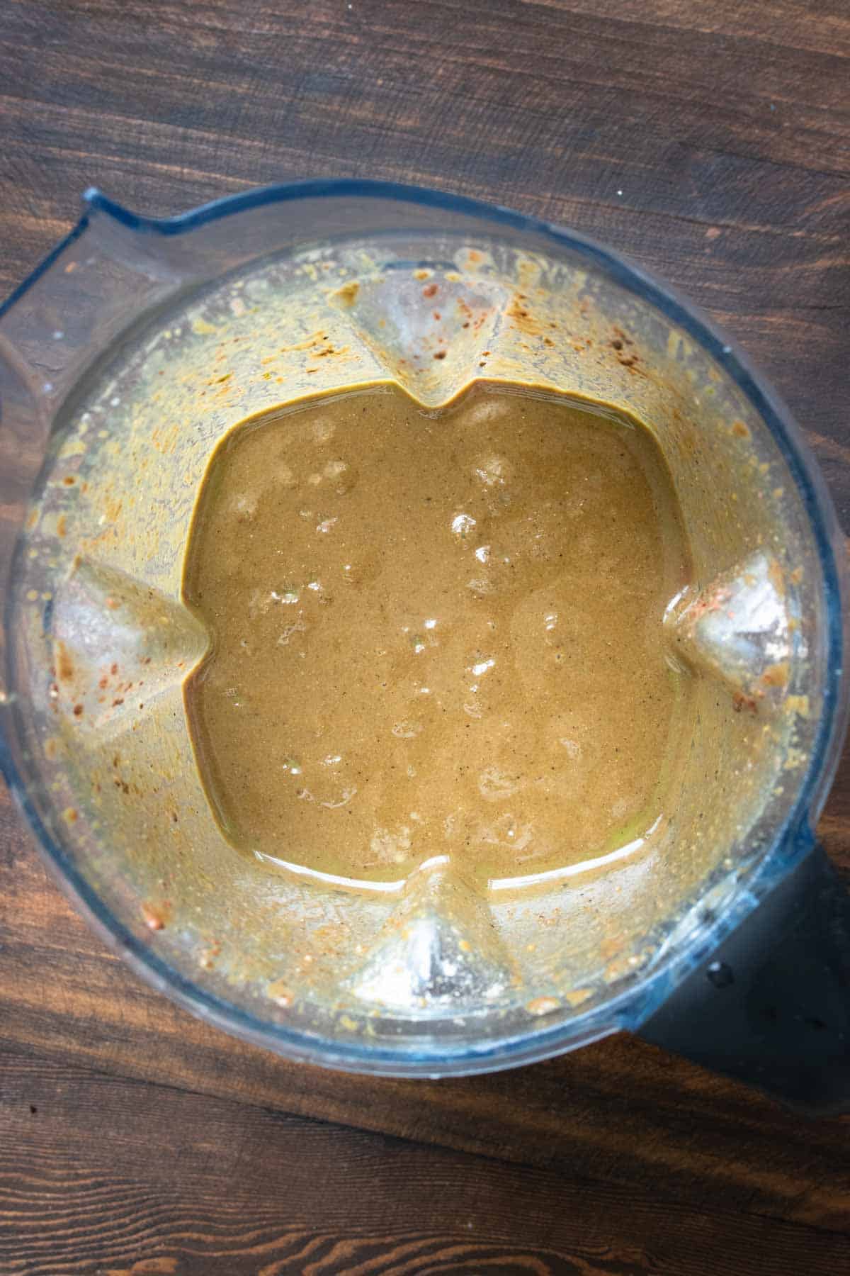 Top view of a blender with blended chocolate coffee smoothie.